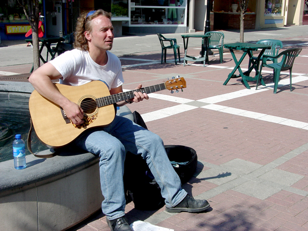 Mark busking Commons, 